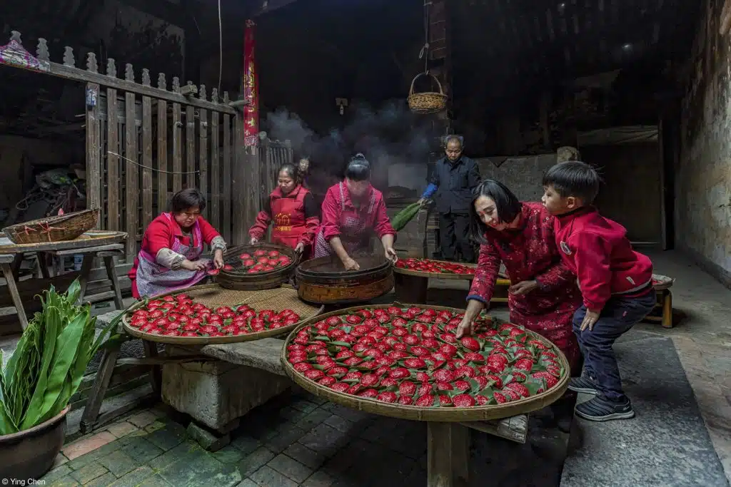 Pink Lady Food Photographer of the Year show image of traditional cooking skills on display in Chinese village. 