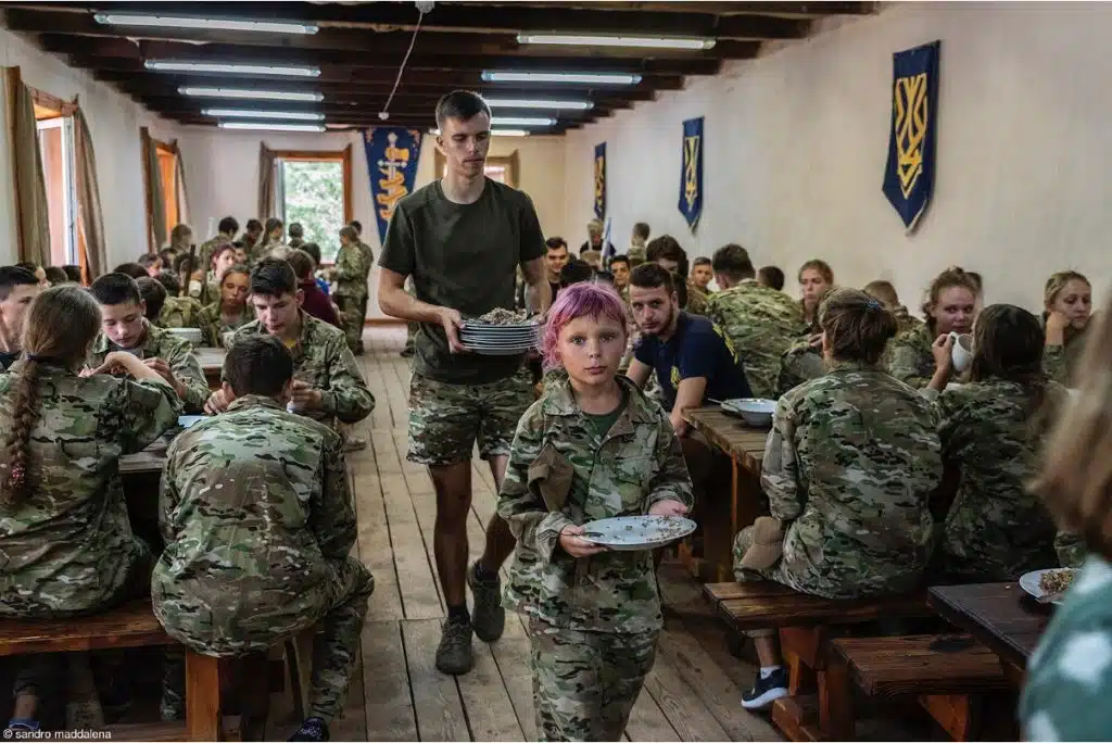 This entrant to the Pink Lady Food Photographer of the Year shows a lunch break at a summer military camp for children held in Kyiv by the Azov Battalion.